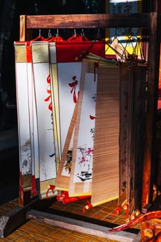 Scrolls with manuscripts and hieroglyphs in a souvenir shop in Asia
