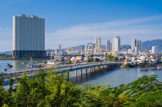 Panoramic view of Cai River and Xom Bong Bridge in Nha Trang city in Asia in summer. Nha Trang, Vietnam - August 8, 2024