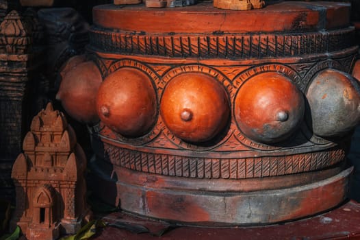 Clay figurine and statue of lingam in a souvenir shop in Vietnam in Asia