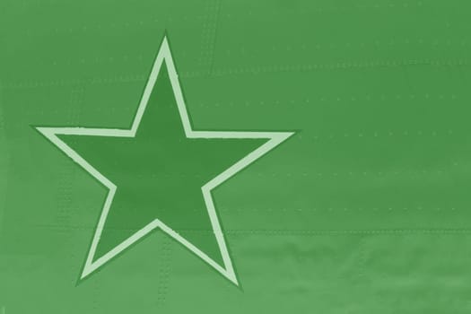 Metal casing with army star. The fuselage of the aircraft is green with a painted army star.