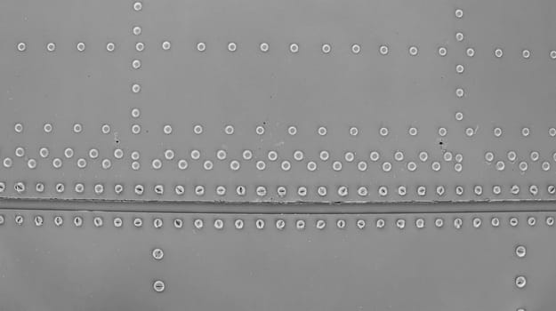 Abstract metallic background with rivets. Armor protection of the technique.