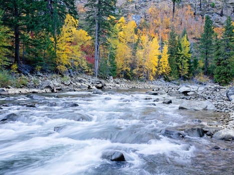 The rapids in the Tumwater Canyon area of the Wenatchee river in autumn near Leavenworth, Washington.
