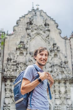 Male tourist in the central square of Mexico City, Zocalo. Cultural exploration, travel, and historic architecture concept.