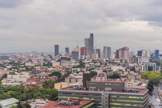 Panoramic view of Mexico City from above, showcasing the sprawling urban landscape, iconic landmarks, and vibrant culture. Cityscape, travel, and architecture concept.