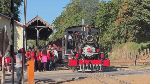 In Tiradentes, Brazil, the iconic Maria Fumaca steam train moves backwards to connect with carriages as an eager crowd watches, on June 14, 2024.