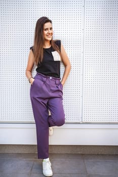 Nice Smiling businesswoman standing outoors.