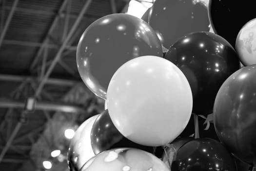 Vibrant black and white balloons, stylishly decorative, ideal for festive occasions and celebrations