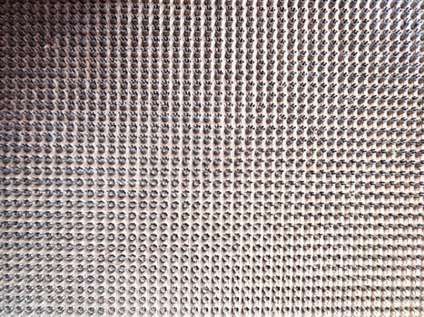 A detailed perspective of a surface filled with numerous small metallic components.
