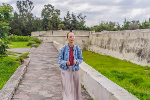 Female tourist exploring the Loreto Fort Museum in Puebla, Mexico. Cultural heritage, history, and travel exploration concept.