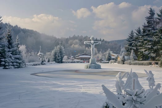 A beautifully serene winter scene that features a stunning statue entirely surrounded by snowcovered trees