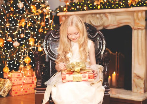 Christmas, celebration, people concept - happy child with gift box