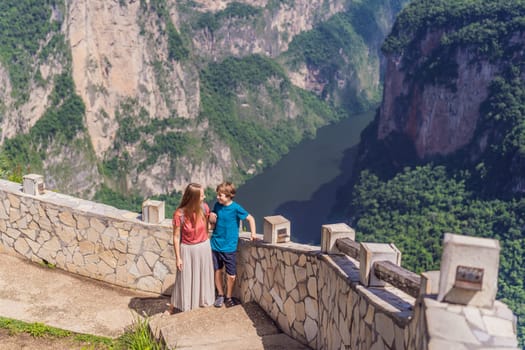 Mom and her son travelers exploring Sumidero Canyon National Park, Mexico. Adventure, natural exploration, and travel experience concept.