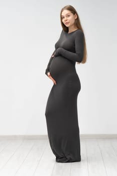 female pregnancy positive motherhood black girl maternity dress background tummy expectant mother