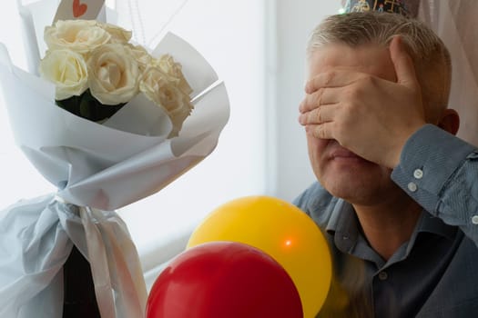 Mid aged man celebrating alone