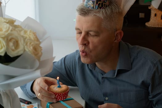 Mid aged man celebrating alone
