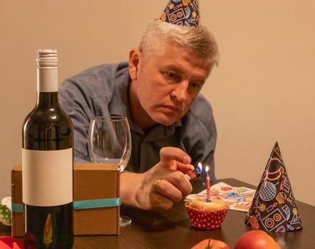 Mid aged man celebrating alone.