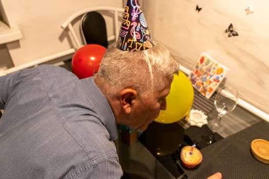 Mid aged man celebrating alone.