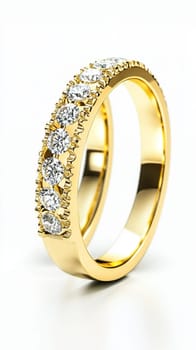 Simple gold engagement ring with a large diamond is sparkling on a white background. The ring is simple but elegant, perfect for a proposal