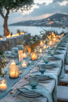 A beautifully set table in a natural environment, adorned with candles and tableware under the open sky. The property is enhanced by the soft light and flowing water nearby