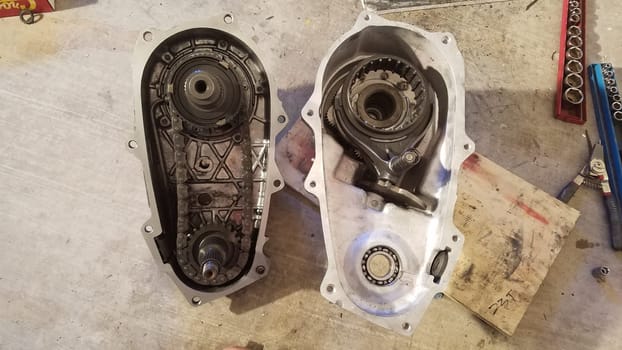 Two Halves of a Transfer Case from 1990s SUV Opened Up to Work On and Repair. High quality photo