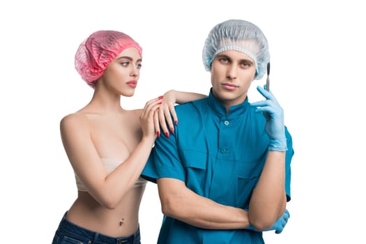 Handsome plastic surgeon with his female pretty patient isolated portrait on white background