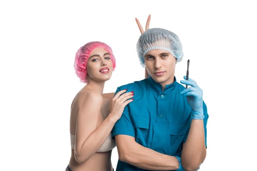Handsome plastic surgeon with his female pretty patient funny isolated portrait on white background