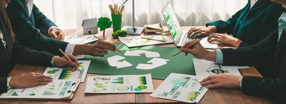 Group of business people planning and discussing on recycle reduce reuse policy symbol in office meeting room. Green business company with eco-friendly waste management regulation concept.Trailblazing