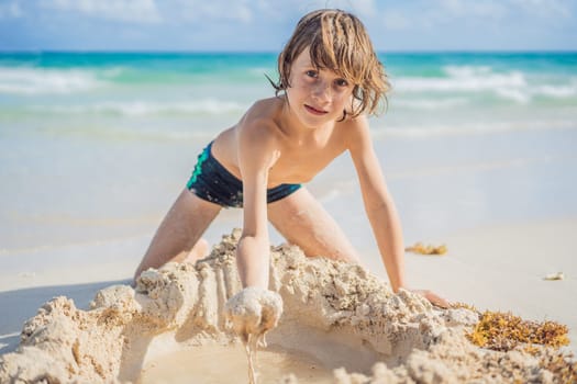 Young boy's pure delight as he explores the sandy playground of the beach, shaping dreams with grains of sand.