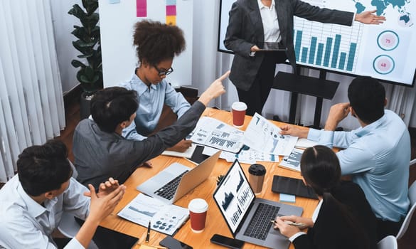 Top view business presentation with data analysis dashboard on TV screen in modern meeting room. Business people brainstorming or working together to plan business marketing strategy. Concord