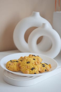 stack of chocolate cookies on wooden background.