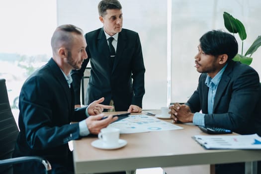 Asian business advisor meeting to analyze and discuss the situation on the financial report in the meeting room.Investment Consultant, Financial , teamwork ,brainstorming ,startup and accounting.