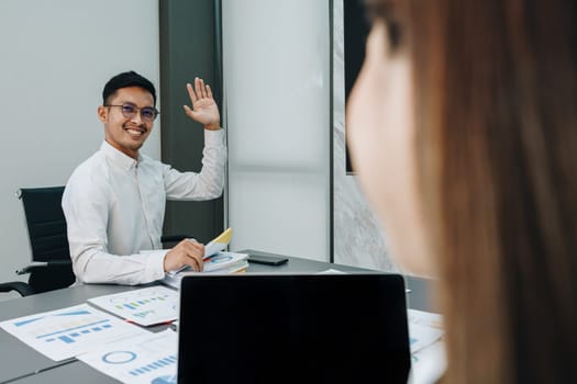 Asian business advisor meeting to analyze and discuss the situation on the financial report in the meeting room.Investment Consultant, Financial , teamwork ,brainstorming ,startup and accounting.