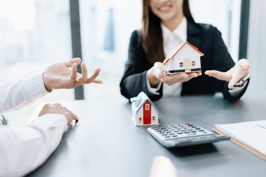 Guarantee, mortgage, agreement, contract, sign, real estate agent delivers the house to the customer after signing important contract documents.