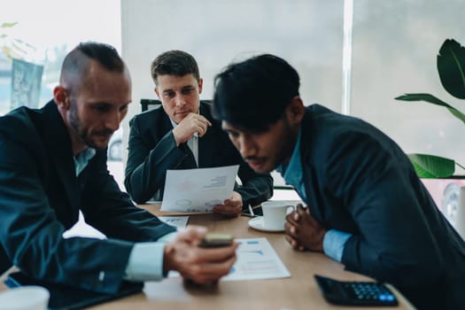 Asian business advisor meeting to analyze and discuss the situation on the financial report in the meeting room.Investment Consultant, Financial , teamwork ,brainstorming ,startup and accounting.