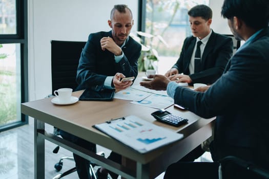 Asian business advisor meeting to analyze and discuss the situation on the financial report in the meeting room.Investment Consultant, Financial , teamwork ,brainstorming ,startup and accounting.