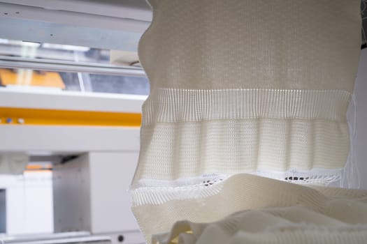 Produced white knitted fabric view at a knitting shop