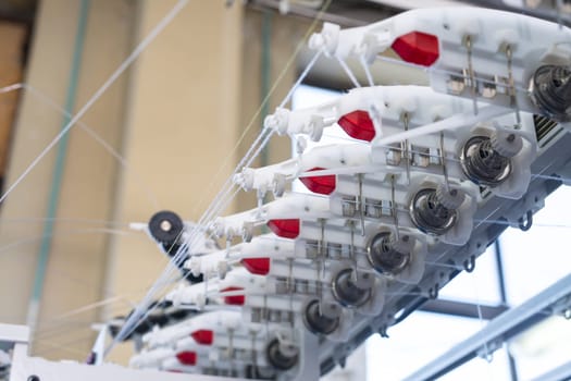 Automatic rewinding machine equipment at a knitting shop view