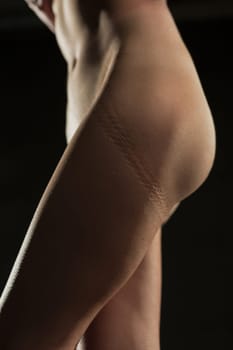 Woman body cropped isolated close up view on black background