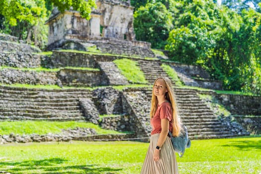 Female tourist exploring the ancient pyramids of Palenque, Mexico, surrounded by dense jungle. Cultural heritage and adventure travel concept.