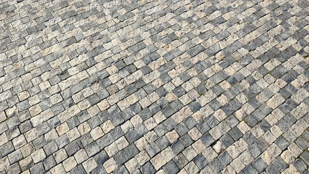 light and dark gray square tiles, road pedestrian pavement, texture background, industry construction. High quality photo
