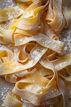 A closeup of a pile of pasta on a wooden table covered in flour, showcasing the staple food ingredient used in various cuisines and recipes