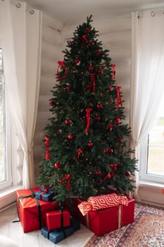 gifts under the tree, lots of gift boxes. Festive mood.