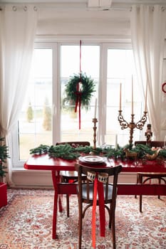 Beautiful Christmas interior. A table and a Christmas tree, a festive table. decoration.