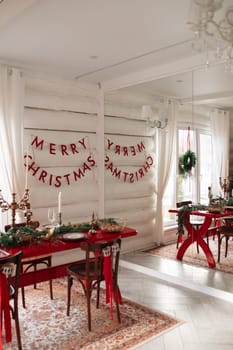 Beautiful Christmas interior. A table and a Christmas tree, a festive table. decoration.