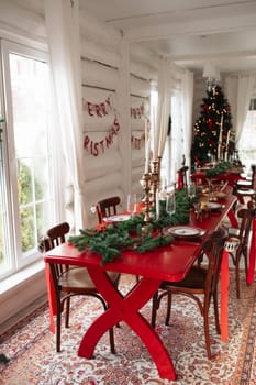 Stylish Christmas tree, New Year's interior, beautiful decor in the house.