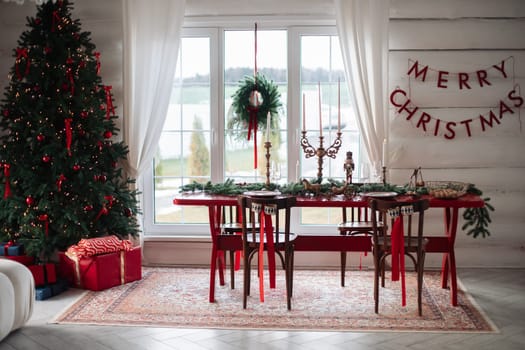 Stylish Christmas tree, New Year's interior, beautiful decor in the house.