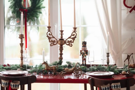 Beautiful Christmas interior. A table and a Christmas tree, a festive table. decoration.
