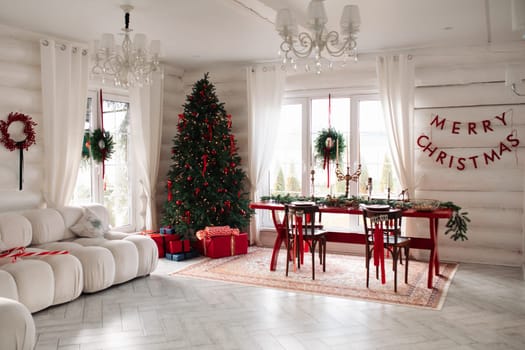 Beautiful Christmas interior. A table and a Christmas tree, a festive table. decoration.