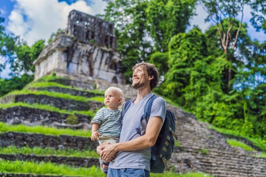 Mother with his toddler son exploring the ancient pyramids of Palenque, Mexico, surrounded by dense jungle. Cultural heritage and adventure travel concept.