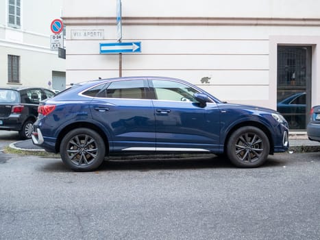 Cremona, Lombardy, Italy October 15th 2024 Sleek, blue audi q3 sportback parked on a quiet residential street, showcasing its modern design and urban adaptability